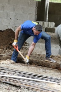 Mixing concrete with water, cement, rocks and sand. Digging the trenches, building walls - making a difference.